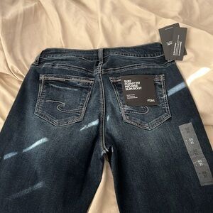 Silver Suki curvy fit mid rise slim boot jeans.